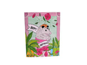 Birthday card with a cartoon raccoon holding a banner on a green tiled background