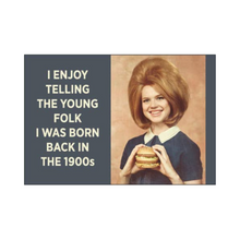  2" x 3" rectangular magnet with image of woman holding a double cheeseburger that reads "I enjoy telling the young folk I was born back in the 1900s."