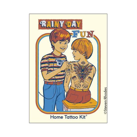 2" x 3" rectangular magnet with one boy giving another boy a tattoo that reads "Rainy Day Fun. Home Tattoo Kit."